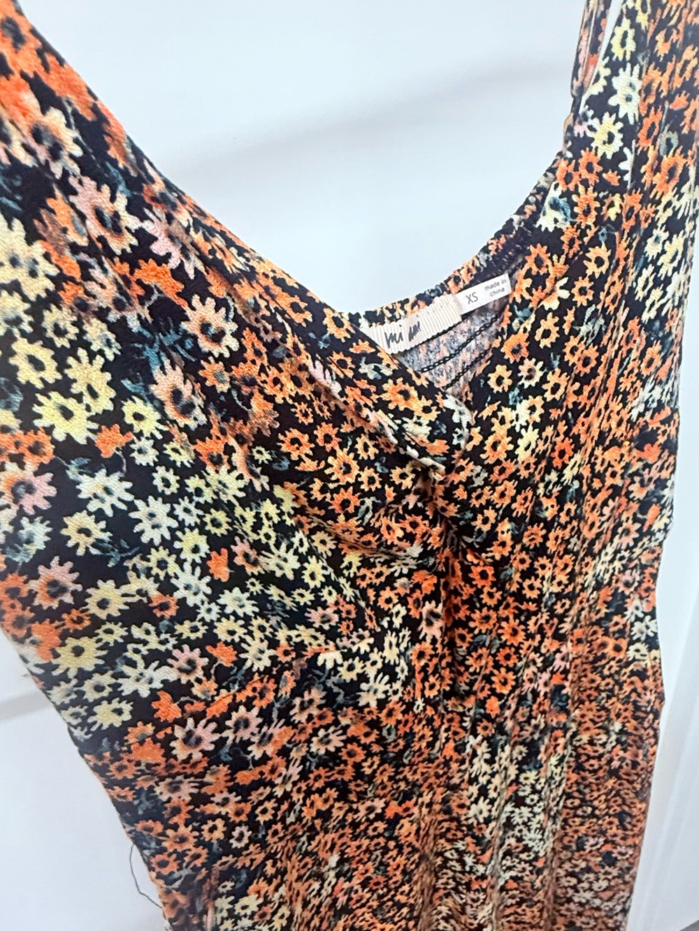 Francesca's Collections Black Floral Jumpsuit with Orange & Yellow Blooms